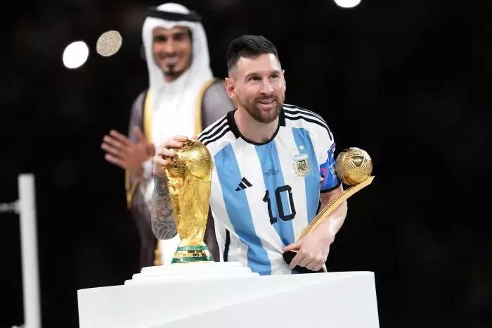 Argentina's Lionel Messi poses with the FIFA World Cup Trophy