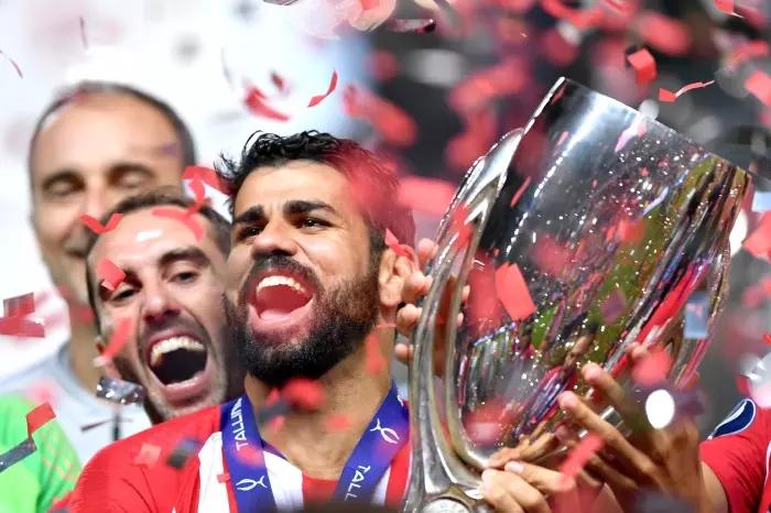 Diego Costa holds up the UEFA Super Cup with Atletico Madrid in 2018