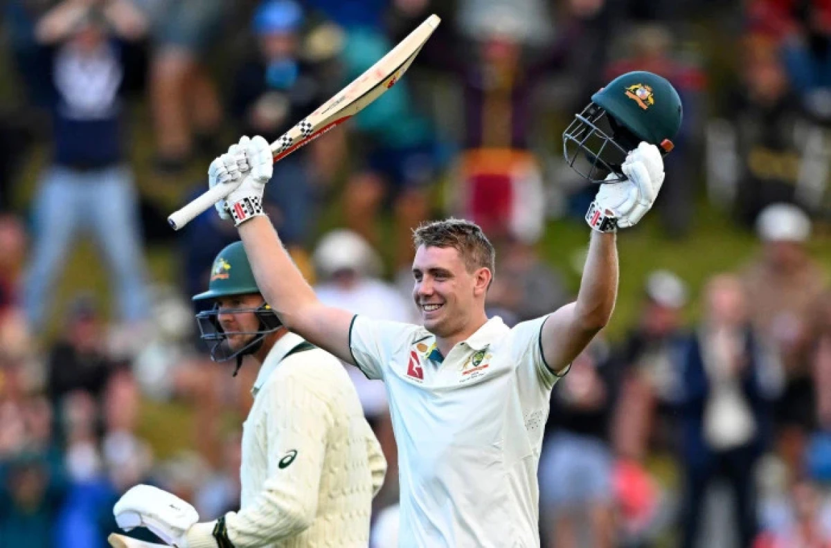 Australia's Cameron Green celebrates scoring 100 runs against New Zealand on the first day of their cricket test match in Wellington, New Zealand