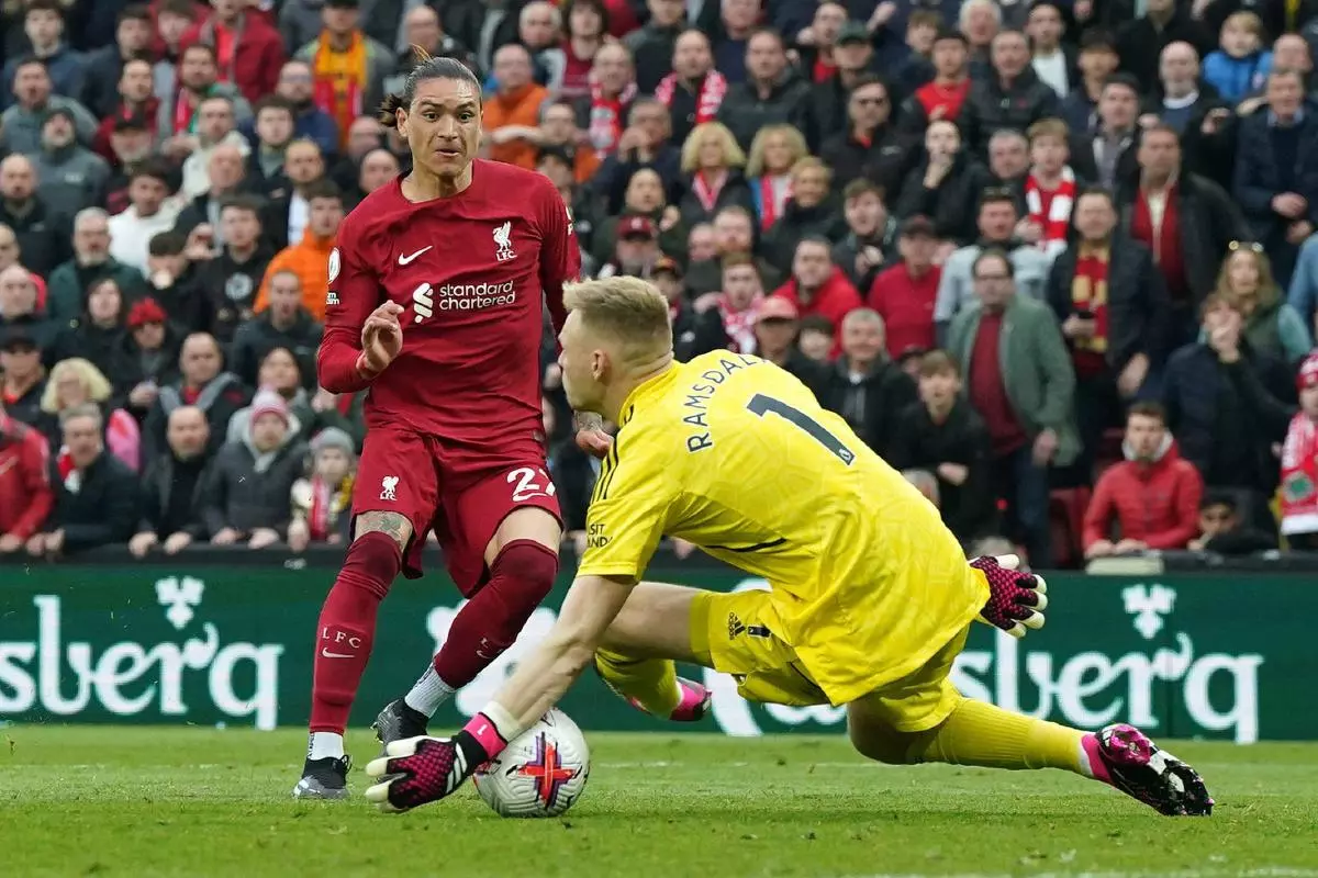 Arsenal goalkeeper Aaron Ramsdale saves from Liverpool's Darwin Nunez
