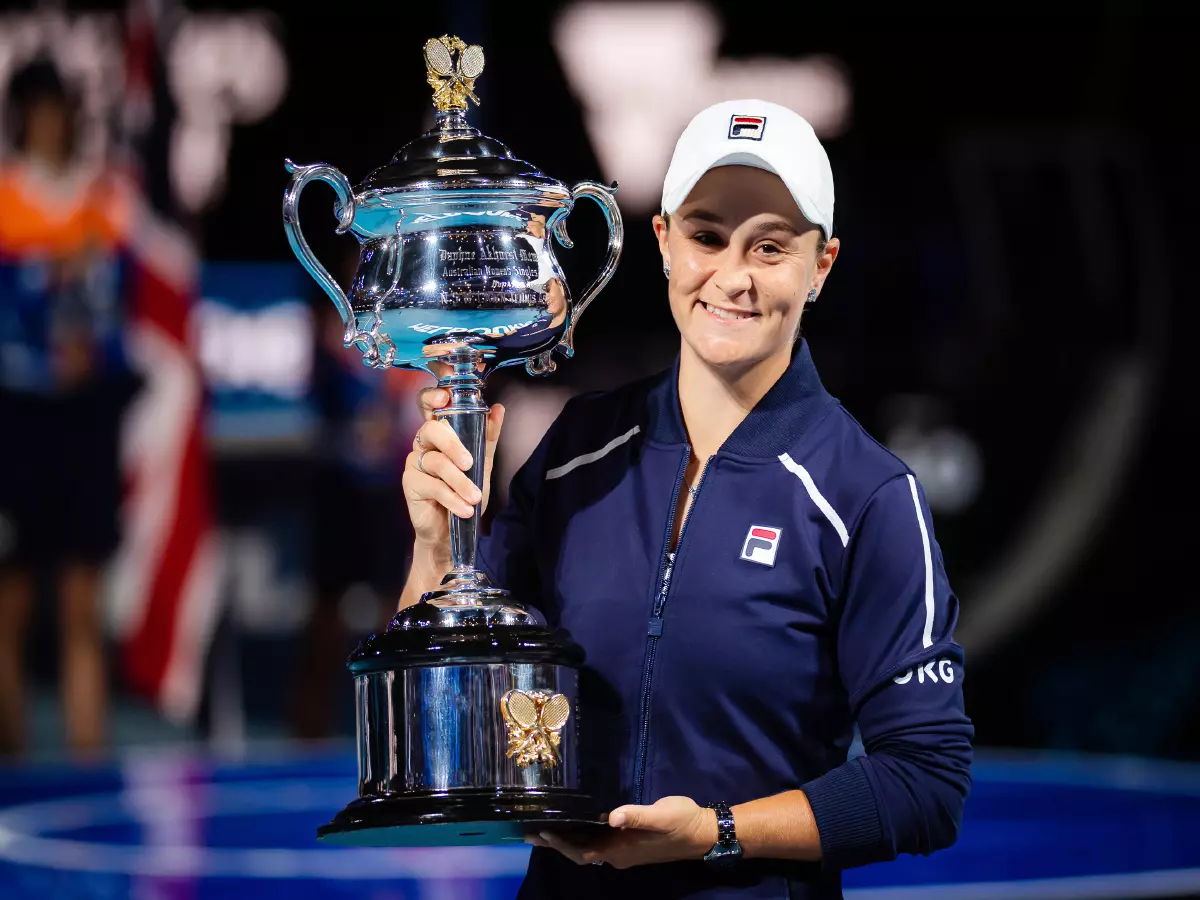 Ashleigh Barty of Australia poses with the champions trophy after winning against Danielle Collins of United States the final of the 2022 Australian Open, Grand Slam tennis tournament on Janu
