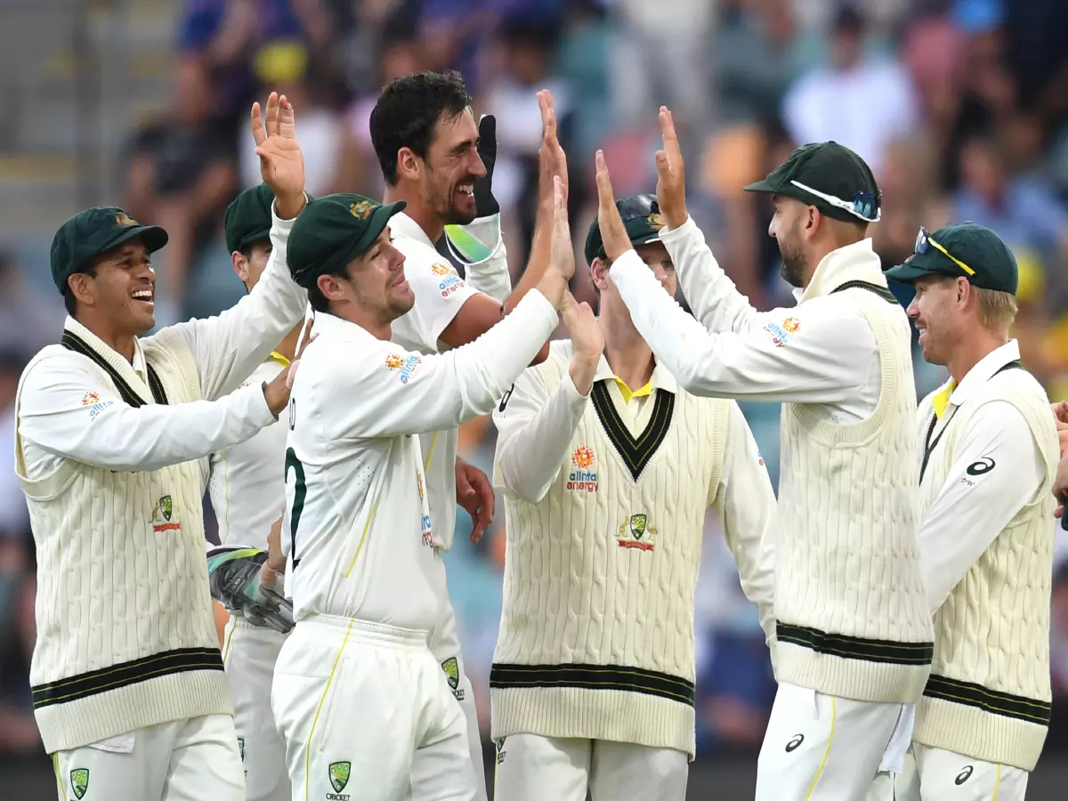 Nathan Lyon (2nd from right) of Australia celebrates with team mates after catching out Ben Stokes of England during Day 2 of the Fifth Ashes Test between Australia and England at Blundstone 
