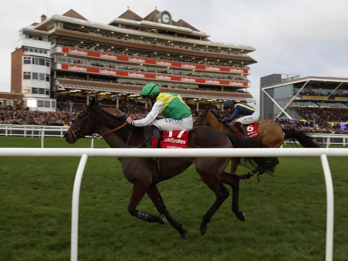 Cloudy Glen ridden by jockey Charlie Deutsch on their way to winning the Ladbrokes Trophy Chase during Ladbrokes Trophy Day, part of the Ladbrokes Winter Carnival at Newbury Racecourse
