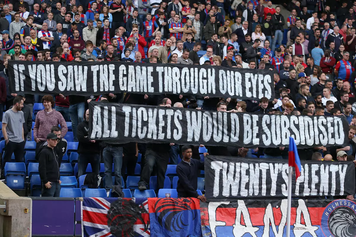 Crystal Palace fans hold a banner