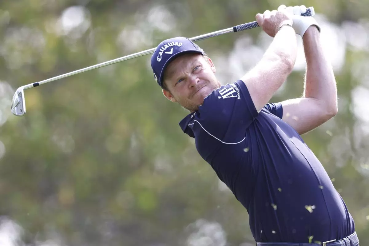 Danny Willett of England hits his tee shot on the 4th hole in the first round of The Masters golf tournament at Augusta National Golf Club
