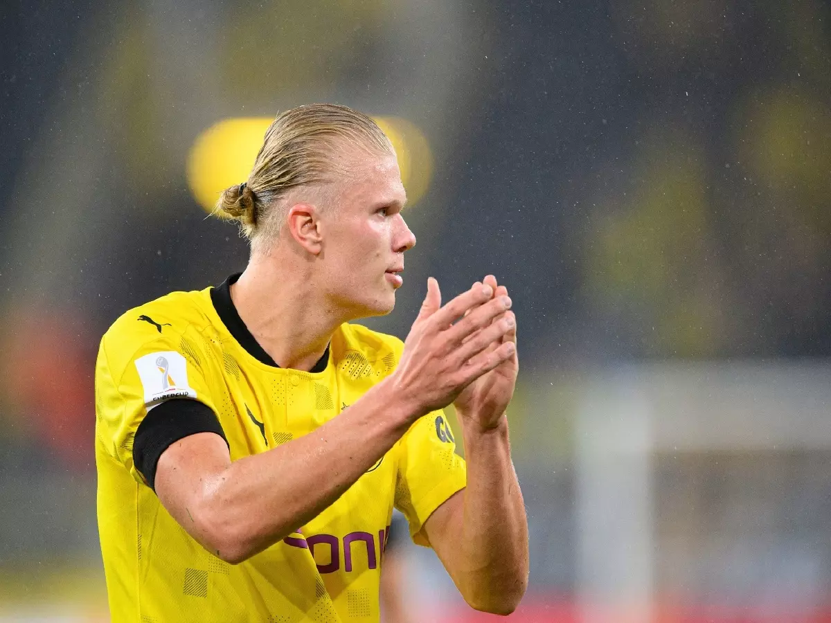 Erling Haaland applauses the support of the Borussia Dortmund faithful following their loss to Bayern Munich