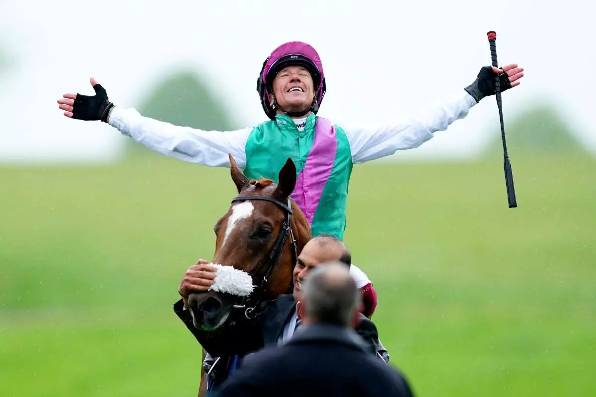 Jockey Frankie Dettori celebrates on Chaldean 