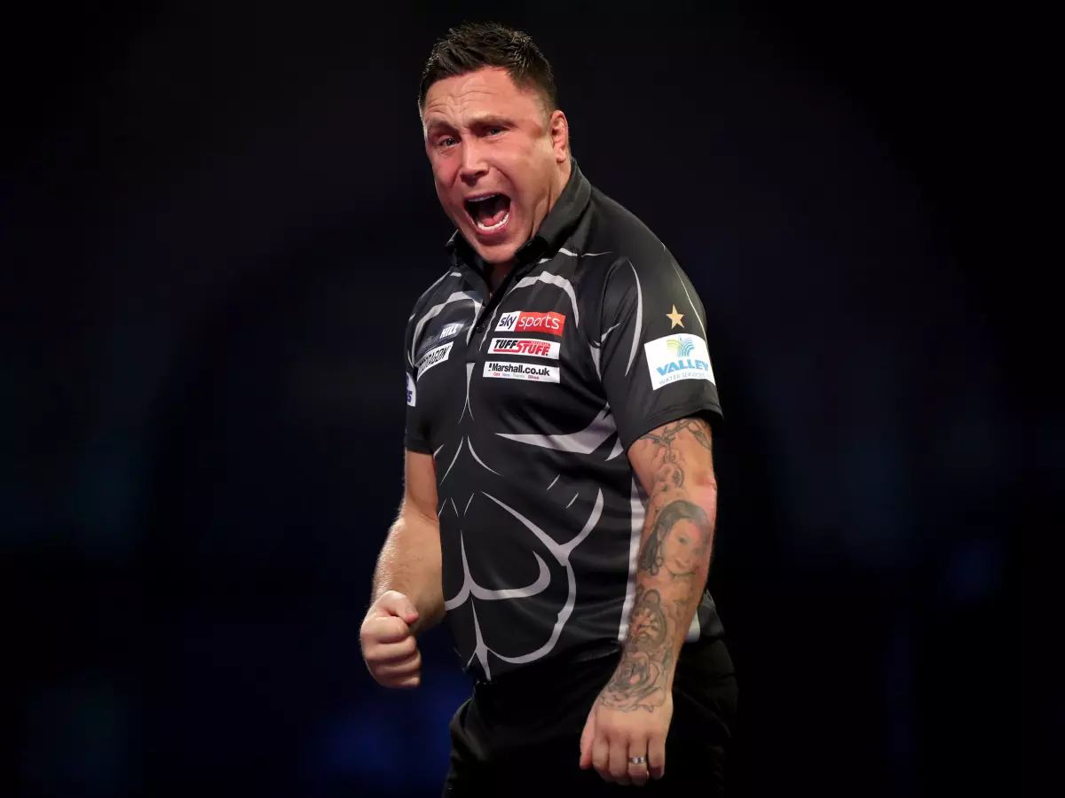 Gerwyn Price celebrates against Kim Huybrechts during day ten of the William Hill World Darts Championship at Alexandra Palace, London. Picture date: Monday December 27, 2021.