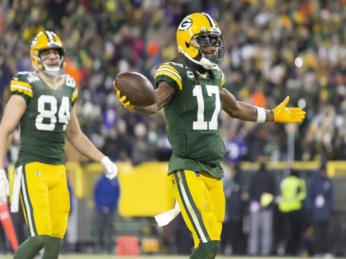 Green Bay Packers wide receiver Davante Adams #17 celebrates scoring a touchdown during NFL football game between the Minnesota Vikings and the Green Bay Packers at Lambeau Field