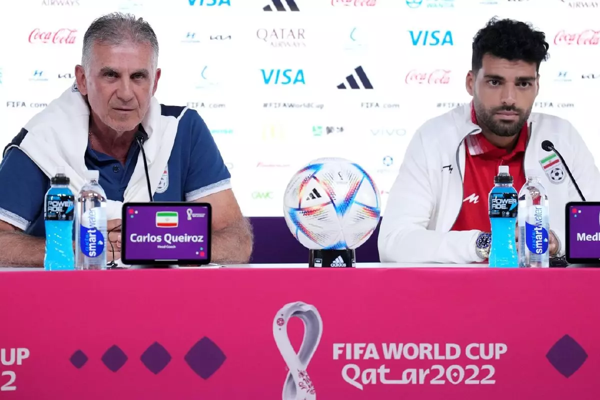 Iran's Mehdi Taremi (right) and manager Carlos Queiroz