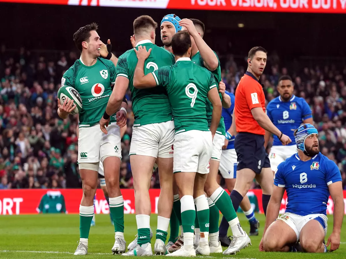 Ireland's Joey Carbery celebrates scoring their side's first try with team-mates during the Guinness Six Nations match at the Aviva Stadium, Dublin. Picture date: Sunday February 27, 2022.