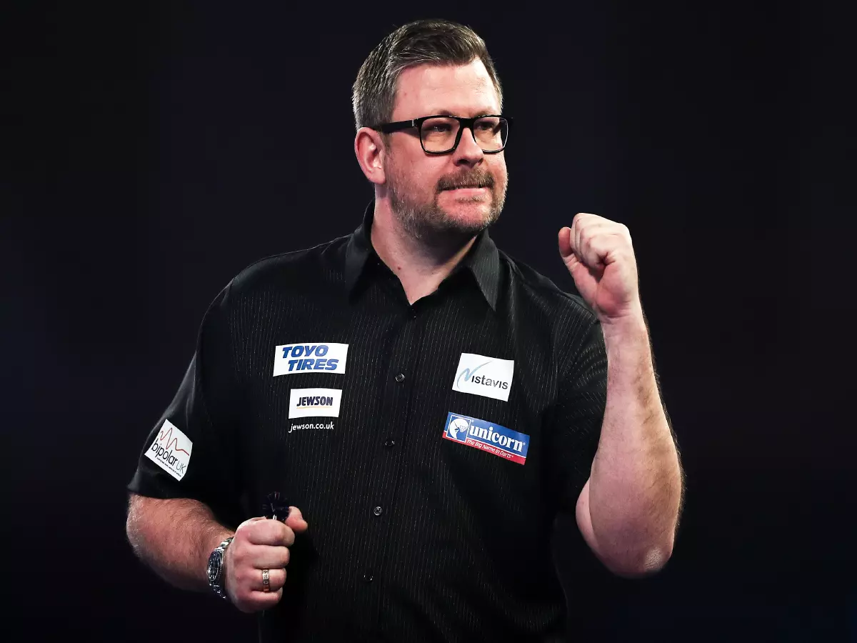 James Wade celebrates after winning a set against Stephen Bunting during day twelve of the William Hill World Darts Championship at Alexandra Palace, London.