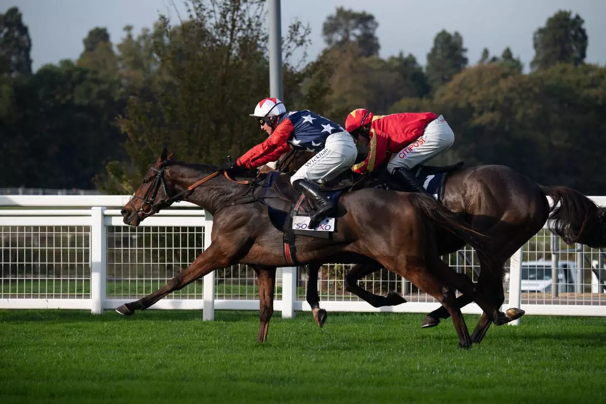 Kitty's Light ridden by jockey Jack Tudor (silk stars) in the Bateaux London Gold Cup Handicap Steeple Chase at Ascot 29th October, 2022