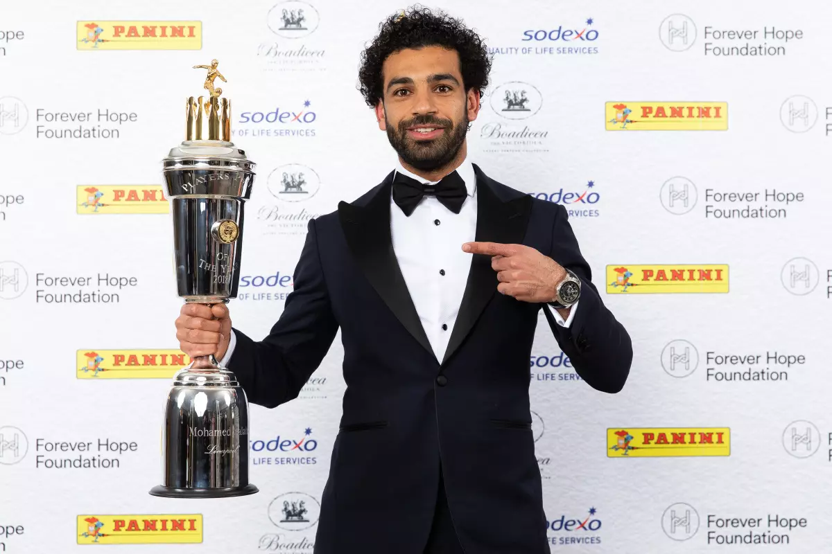 Liverpool's Mohamed Salah poses with the PFA Player Of The Year Award Trophy during the 2018 PFA Awards at the Grosvenor House Hotel, London
