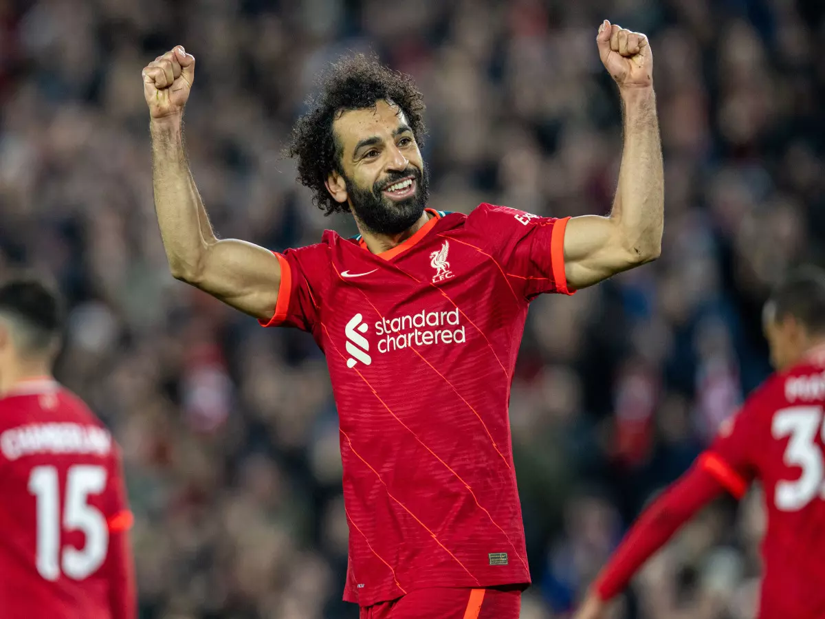 Liverpool's Mohamed Salah celebrates after scoring the third goal during the English Premier League match between Liverpool and Arsenal in Liverpool, Britain, on Nov. 20, 2021.