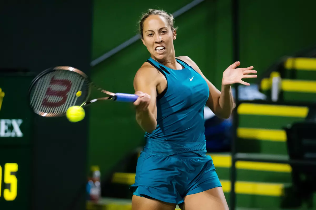 Madison Keys of the United States playing doubles at the 2022 BNP Paribas Open