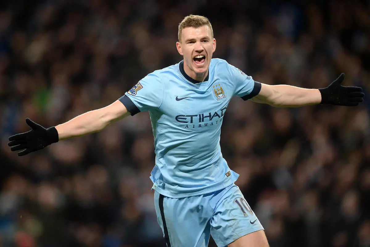 Manchester City's Edin Dzeko celebrates scoring his sides third goal of the game