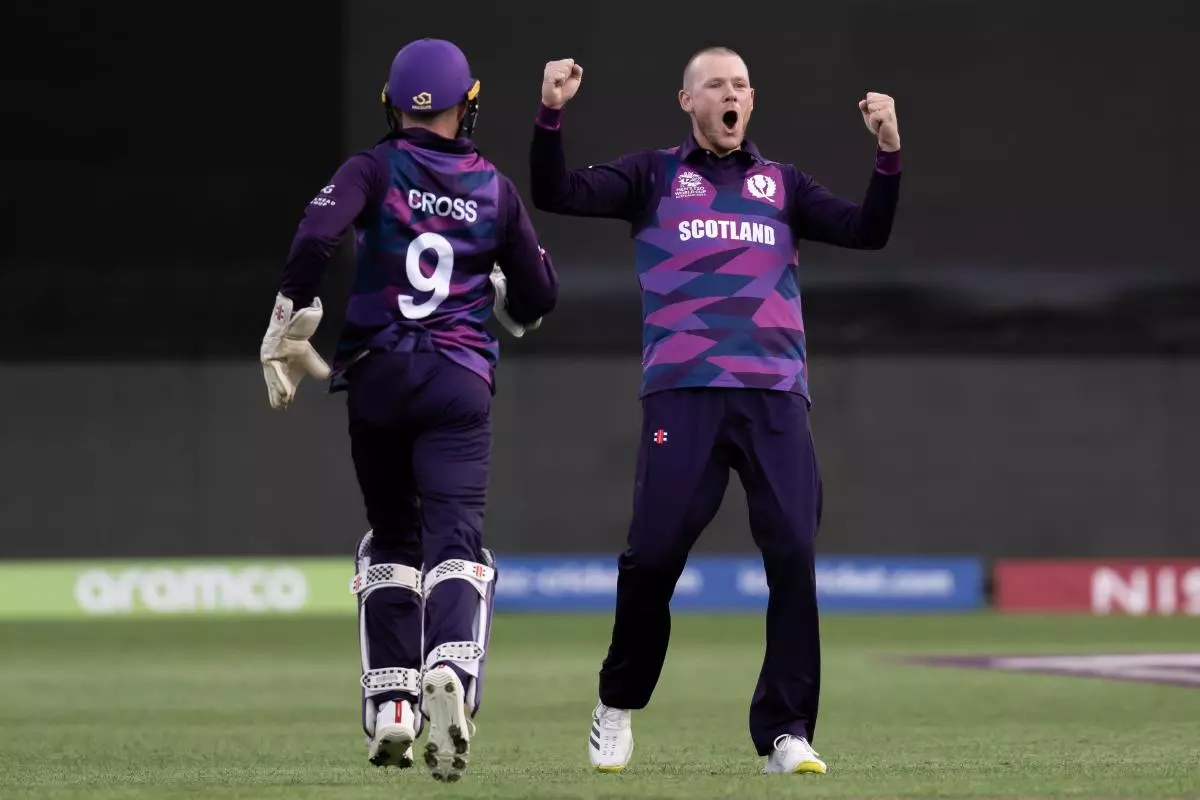 Michael Leask of Scotland celebrates wicket