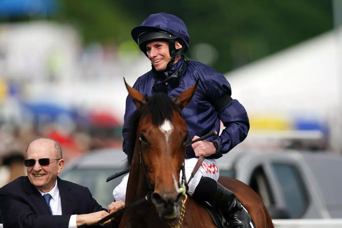 Owner Michael Tabor leads in Ryan Moore on Tuesday