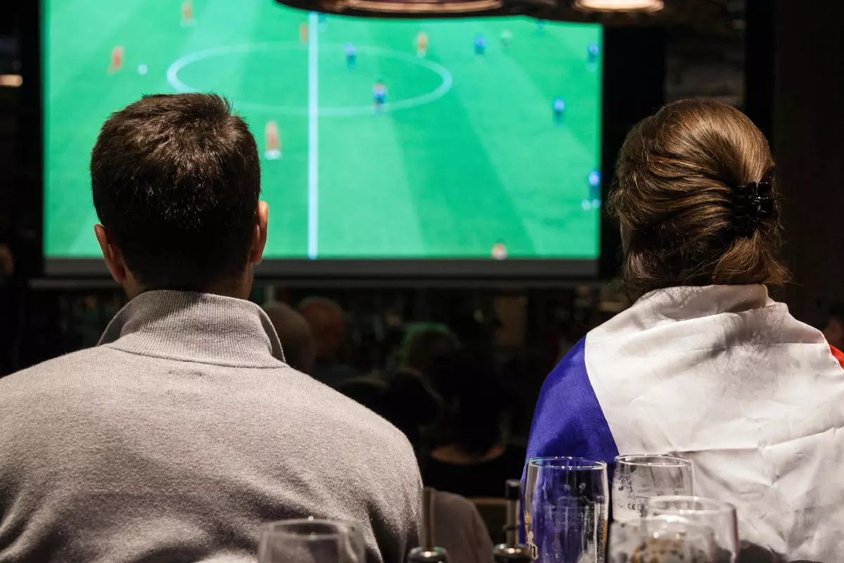 People watching sport on TV