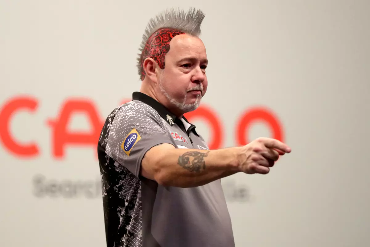 Peter Wright celebrates after winning his Semi Final against Michael Smith at the Aldersley Leisure Village, Wolverhampton. Picture date: Sunday November 21, 2021.