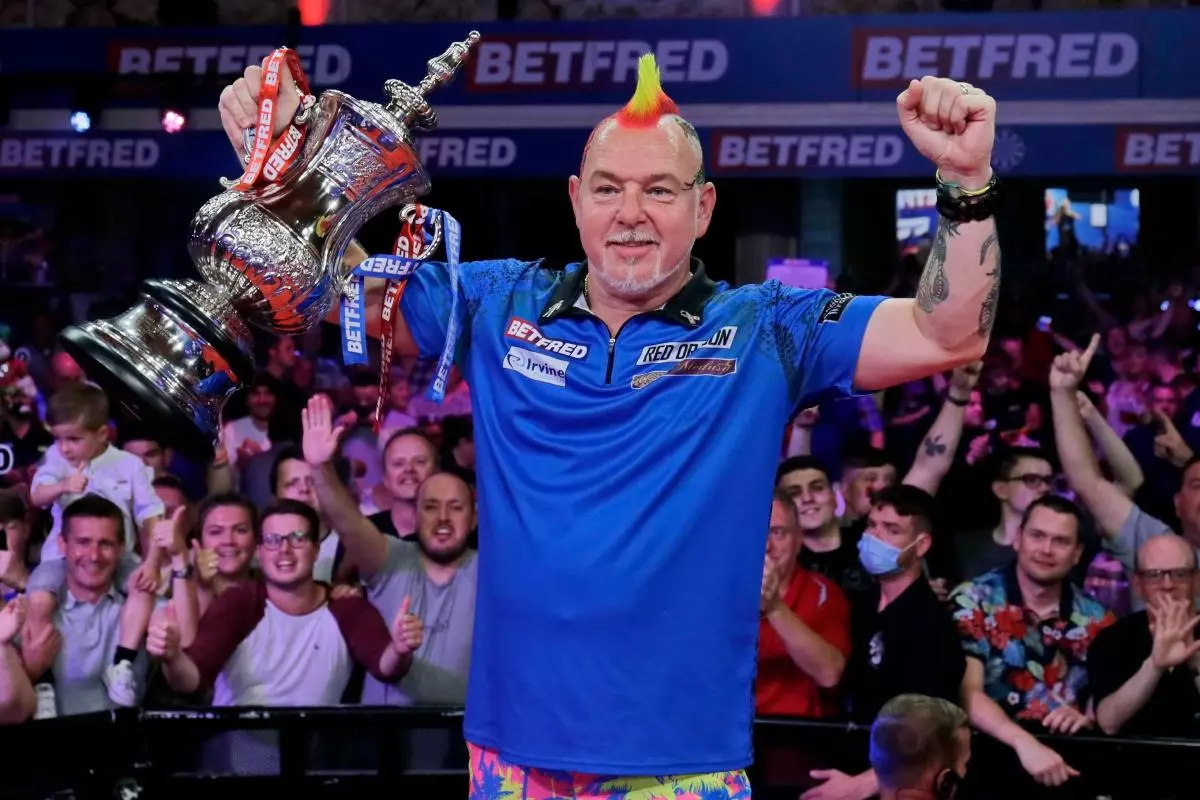 Peter Wright (SCO) holds aloft the World Matchplay trophy