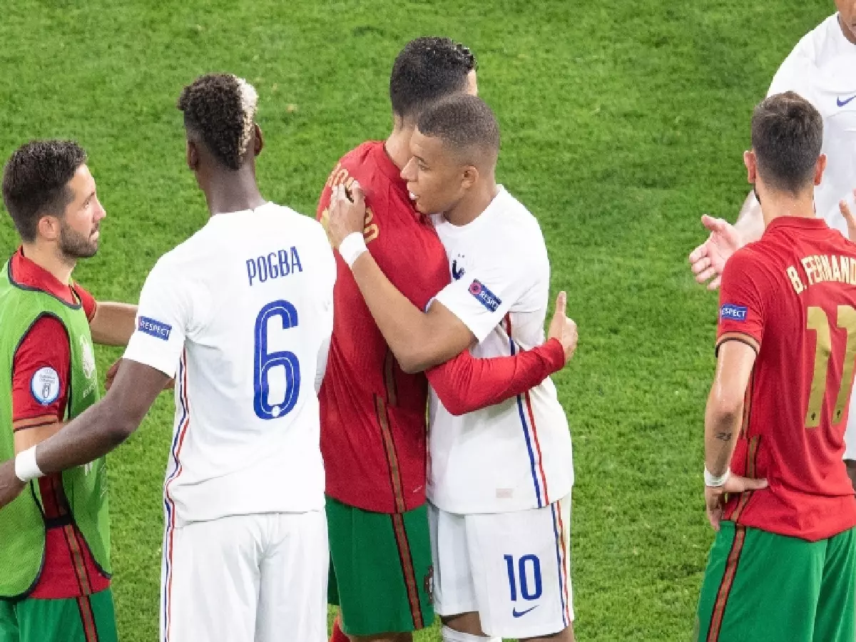 Ronaldo embraces France's Kylian Mbappe Jun21