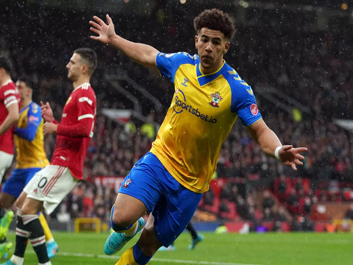 Southampton's Che Adams celebrates after scoring his sides first goal of the game during the Premier League match at Old Trafford, Manchester. Picture date: Saturday February 12, 2022.
