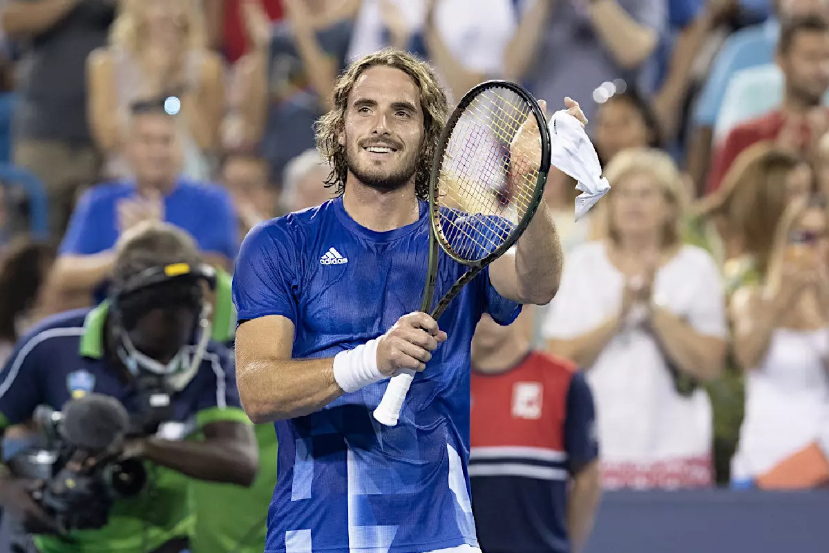 Stefanos Tsitsipas waves to the crowd
