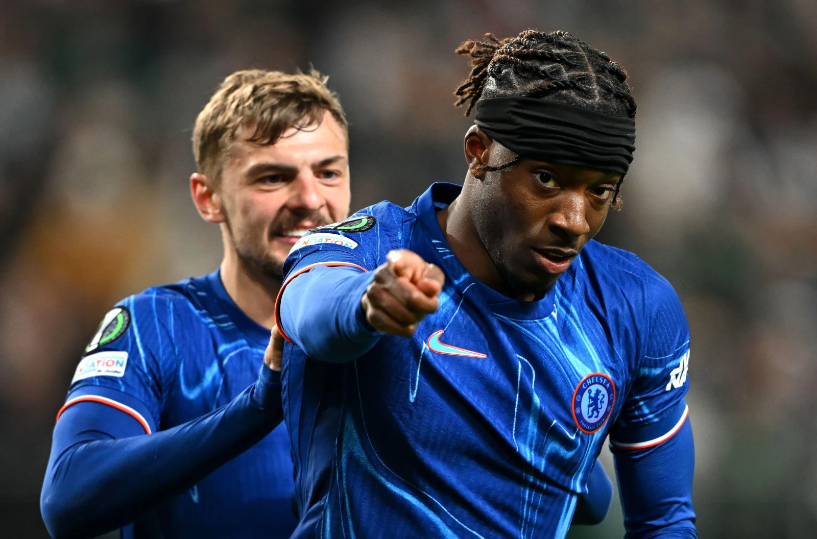 Chelsea's Noni Madueke celebrates scoring their side's third goal of the game during the UEFA Conference League quarter-final against Legia Warsaw