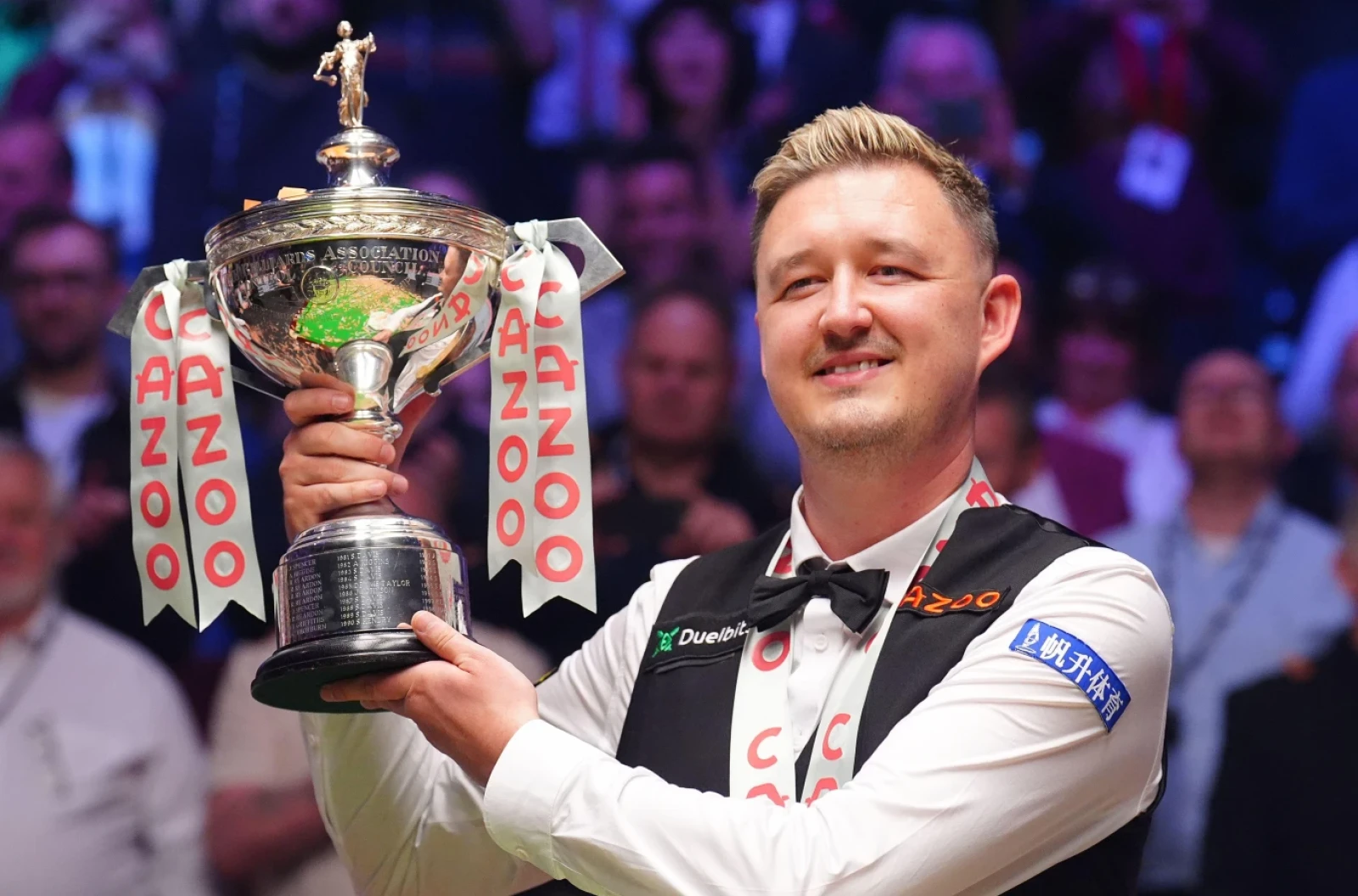 Kyren Wilson celebrates with the trophy after winning the final on day seventeen of the 2024 Cazoo World Snooker Championship at the Crucible Theatre, Sheffield