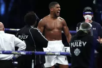 Anthony Joshua celebrates win over Kubrat Pulev