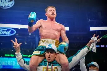 Canelo celebrates stoppage of Saunders as he unifies super middleweight division