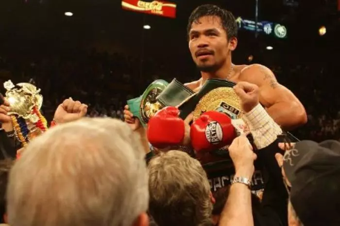 Manny Pacquiao held aloft