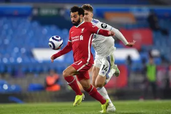 Liverpool's Mohamed Salah (left) and Leeds United's Diego Llorente battle for the ball during the Premier League match at Elland Road, Leeds.