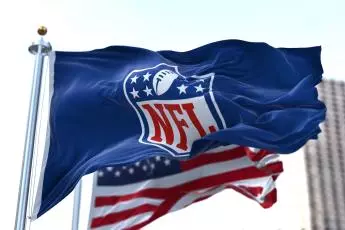 The flag with the NFL logo waving