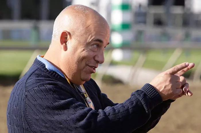 Mark Casse speak with Bob Baffert (not pictured) at Pimlico Race Course in Baltimore, Maryland, May 20, 2016.