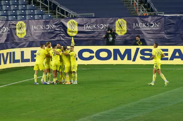 Nashville SC players celebrate together after scoring in an MLS Cup playoff play-in game against Inter Miami CF. Credit: Matthew Maxey/Icon SMI via ZUMA Press