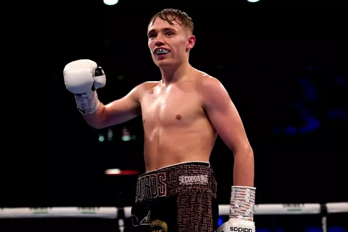 Sunny Edwards celebrates victory over Marcel Braithwaite in the British Super-flyweight Championship fight at the Copper Box Arena, London