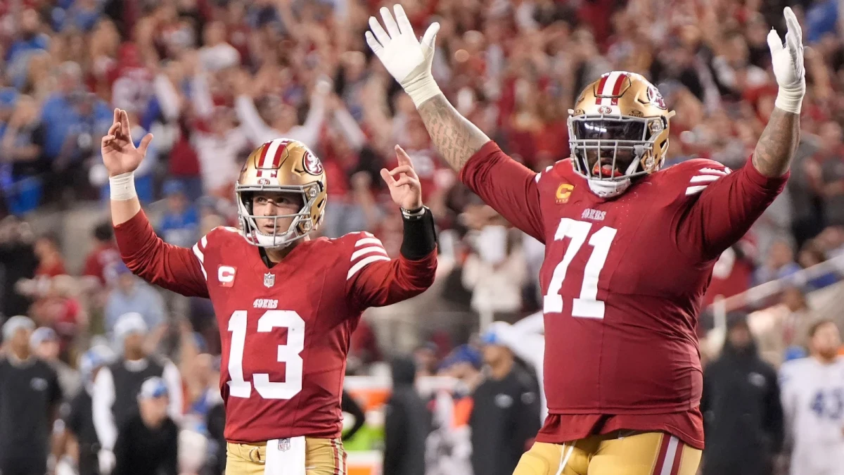 San Francisco 49ers quarterback Brock Purdy (13) and offensive tackle Trent Williams