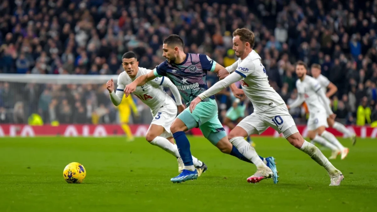 Neal Maupay of Brentford FC pursued by James Maddison of Tottenham