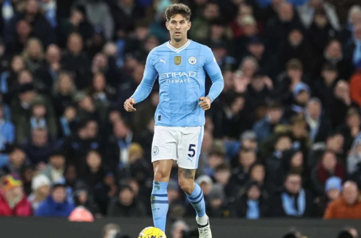 John Stones of Manchester City with the ball during the Premier League match Manchester City vs Burnley - Jan 2024