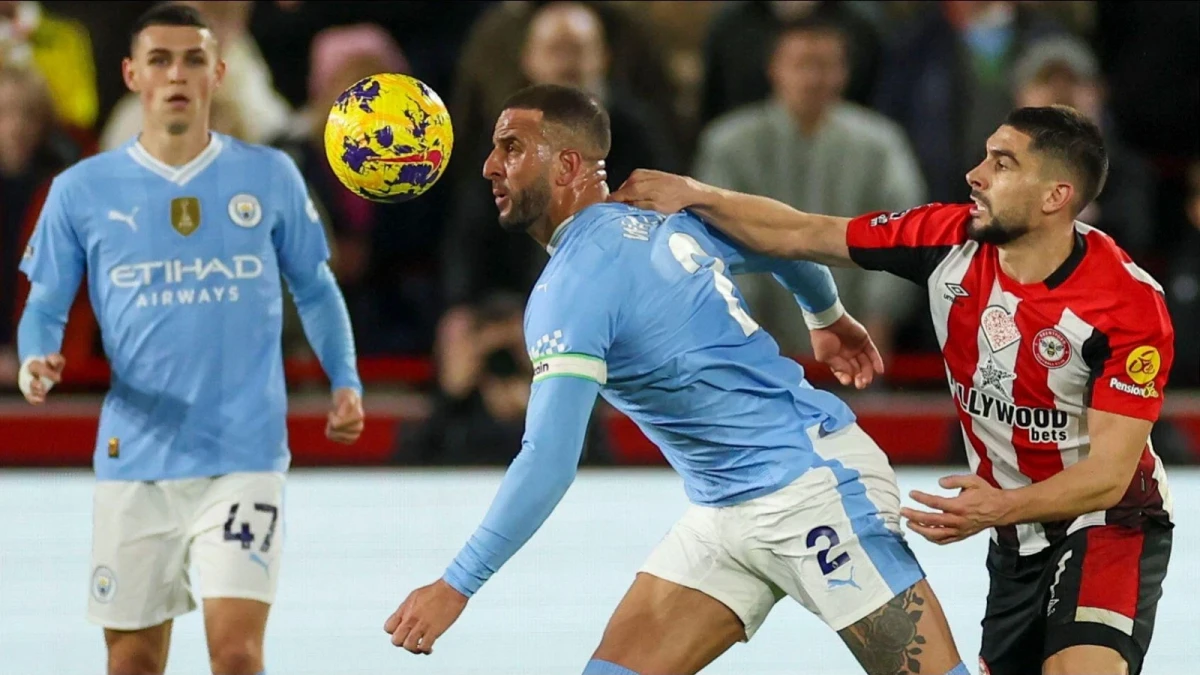 Man City's Kyle Walker and Neal Maupay of Brentford,