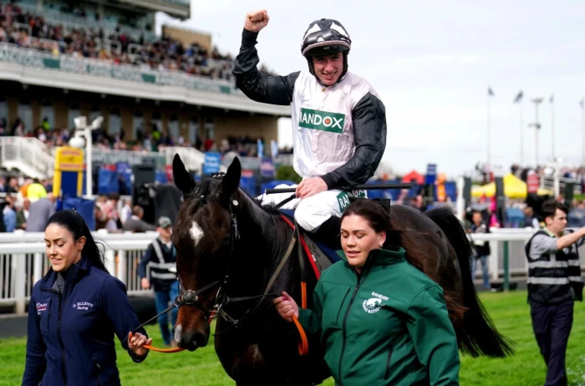 Jockey Jack Kennedy celebrates on Gerri Colombe after winning the William Hill Bowl Chase
