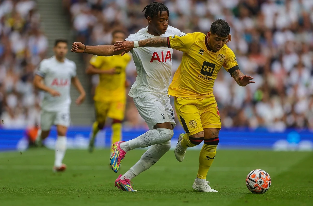 Tottenham's Destiny Udogie and Sheffield United goalscorer Gustavo Hamer