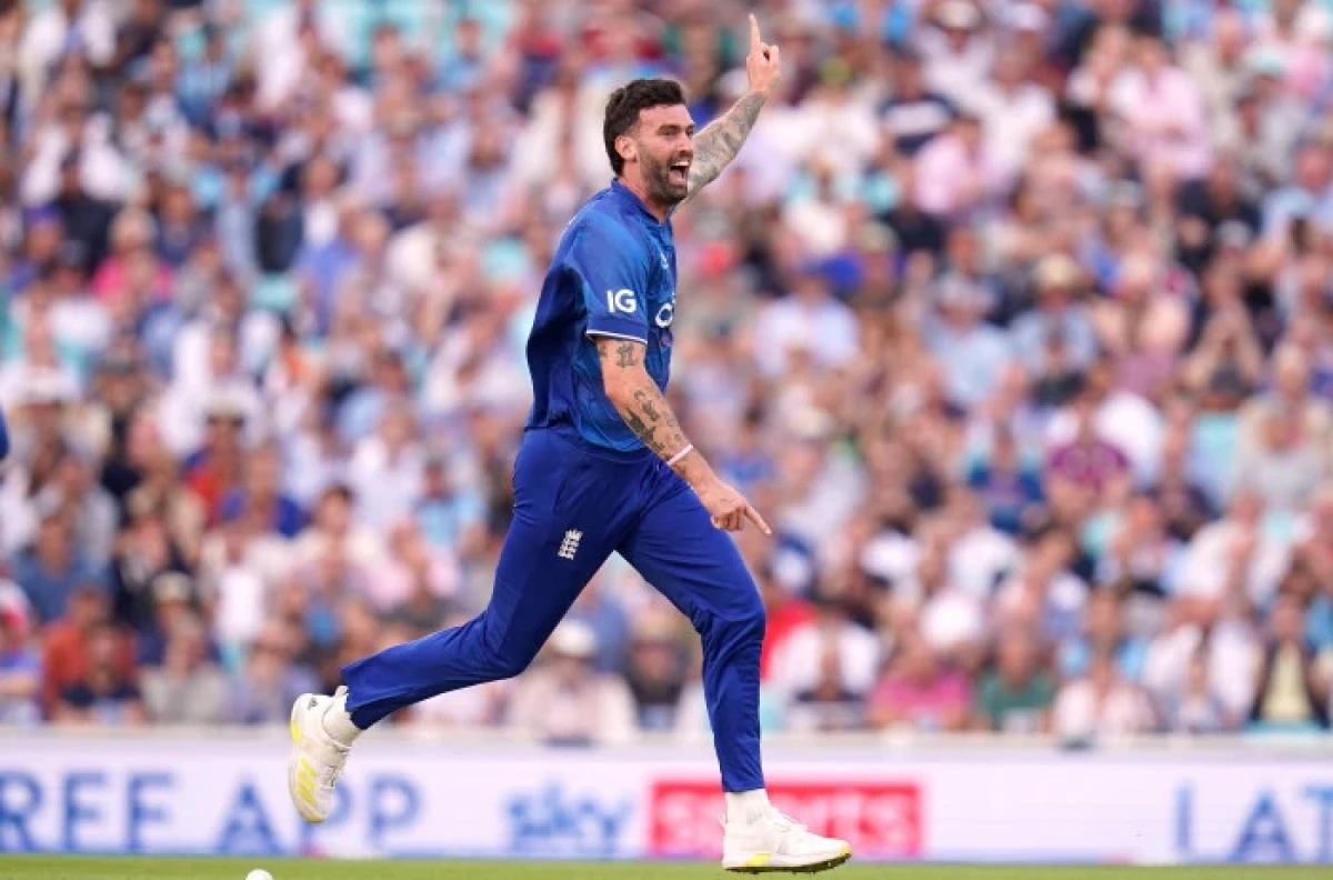 England's Reece Topley celebrates taking the wicket of New Zealand's Devon Conway - Oct 2023