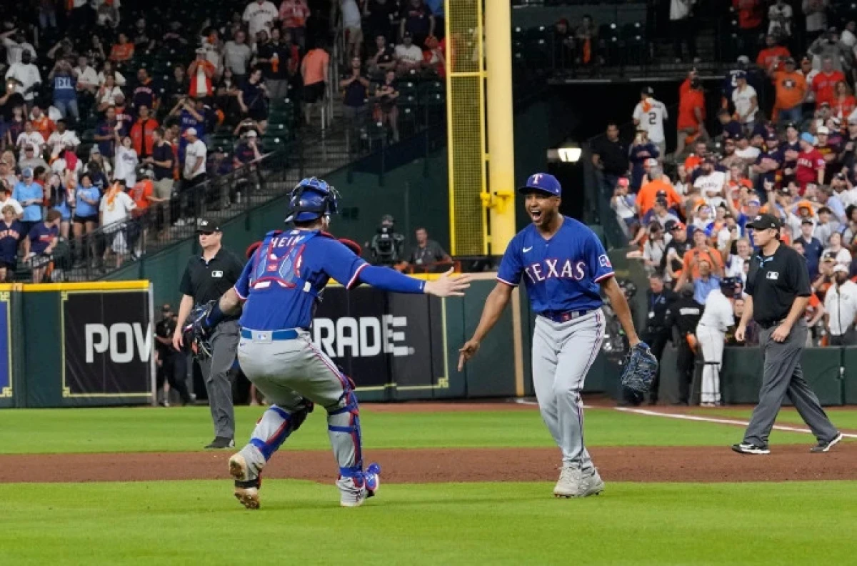 Texas Rangers' Jose Leclerc and Jonah Heim celebrate after Game 7 of the baseball AL Championship Series - Oct 2023
