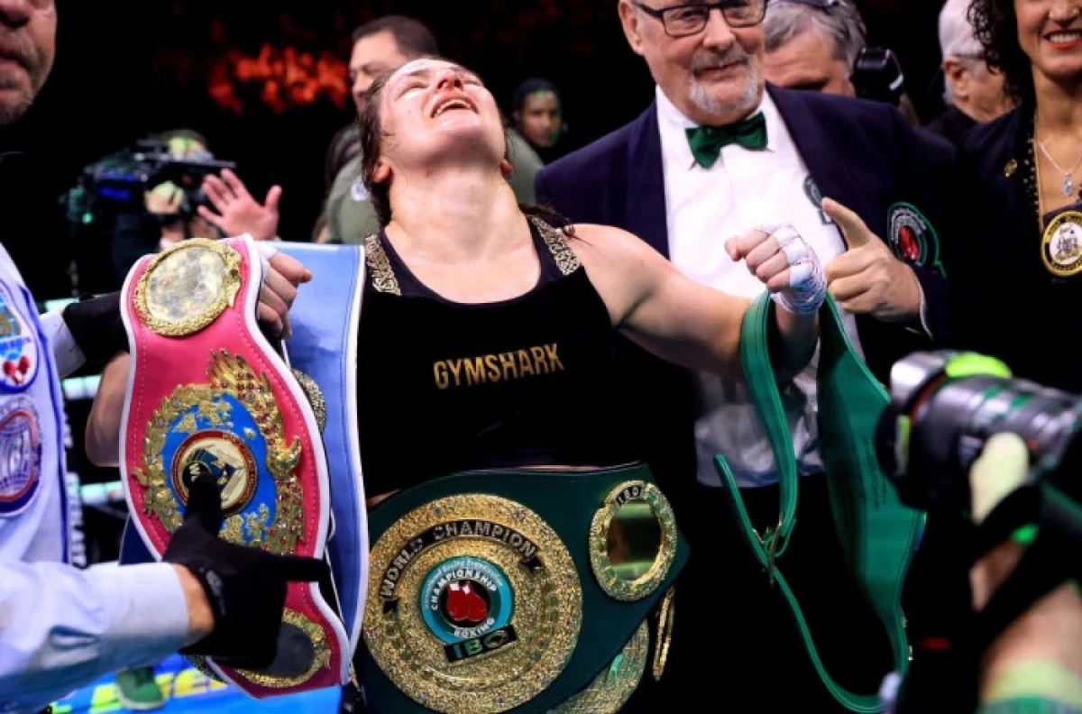 Katie Taylor celebrates after winning her Undisputed Super Lightweight title fight against Chantelle Cameron at the 3Arena in Dublin - Nov 2023