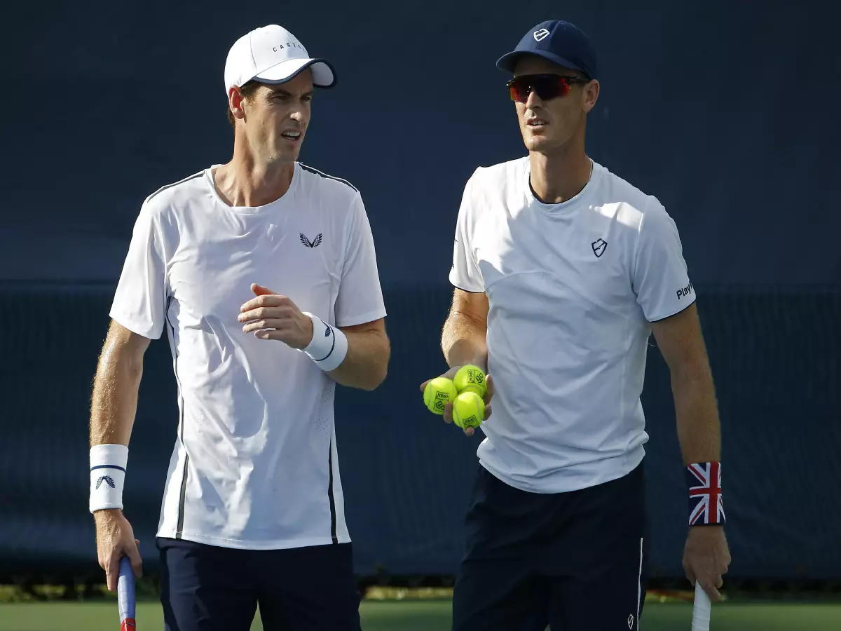Andy Murray of Great Britain (L) talks with his brother Jamie Murray of Great Britain