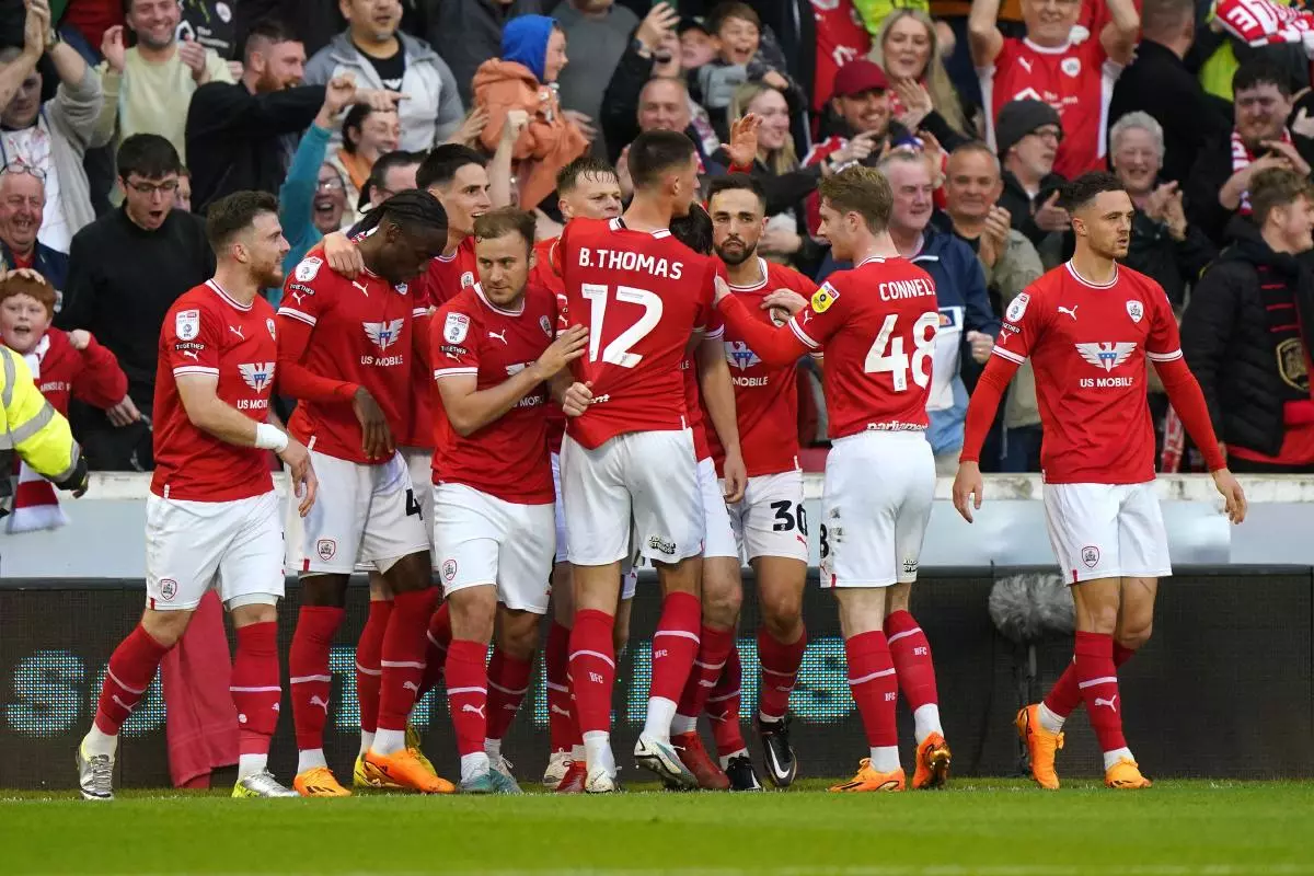 Barnsley's Liam Kitching celebrates with team-mates